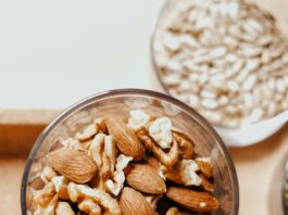 'Nuts for Heart and Weight Control' A bowl of mixed nuts, including almonds and pistachios.