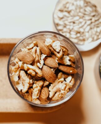 'Nuts for Heart and Weight Control' A bowl of mixed nuts, including almonds and pistachios.