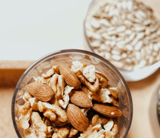 'Nuts for Heart and Weight Control' A bowl of mixed nuts, including almonds and pistachios.